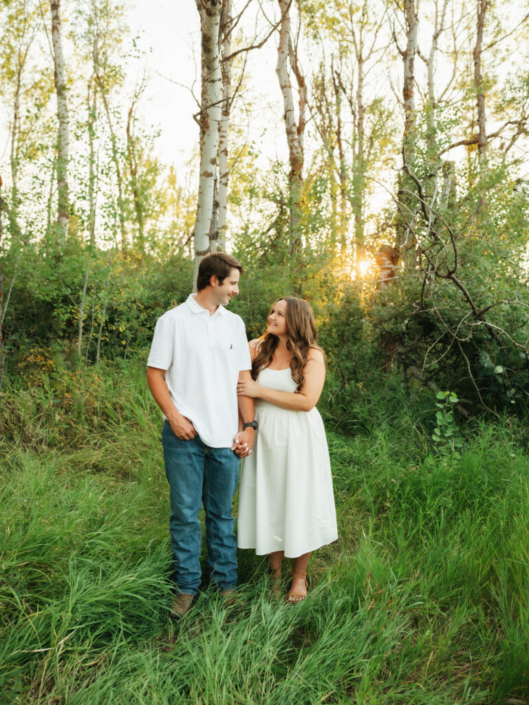 A relaxed late summer engagement session in East Spokane featuring golden fields, natural light, and an outdoors-loving couple.