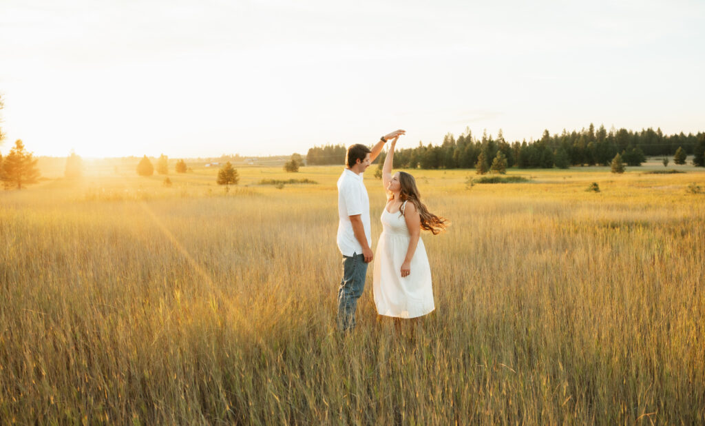 A relaxed late summer engagement session in East Spokane featuring golden fields, natural light, and an outdoors-loving couple.