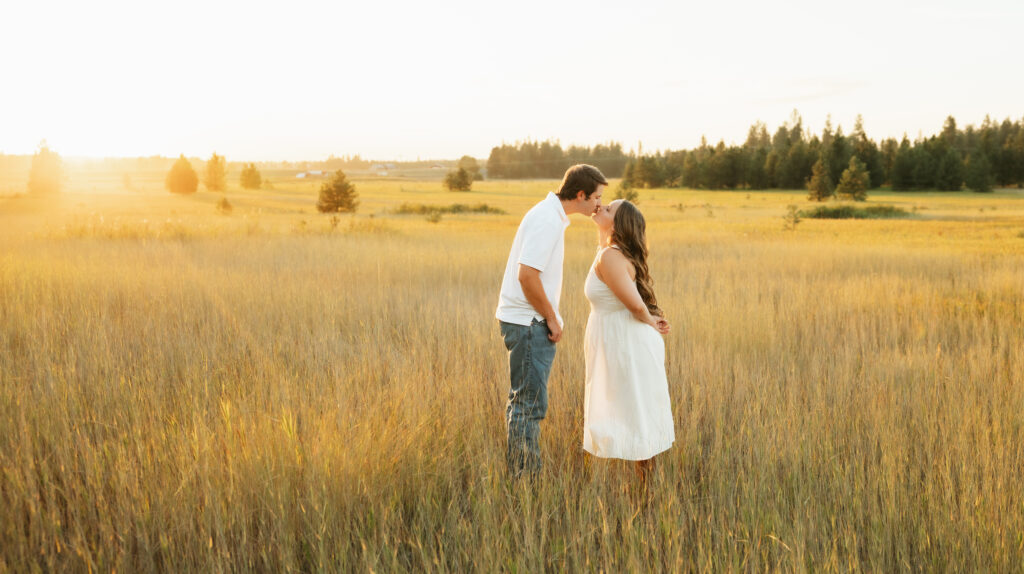 A relaxed late summer engagement session in East Spokane featuring golden fields, natural light, and an outdoors-loving couple.