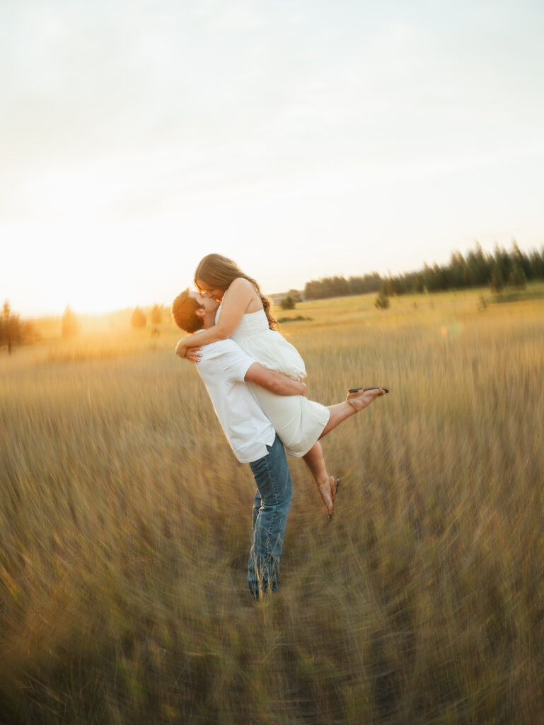 A relaxed late summer engagement session in East Spokane featuring golden fields, natural light, and an outdoors-loving couple.