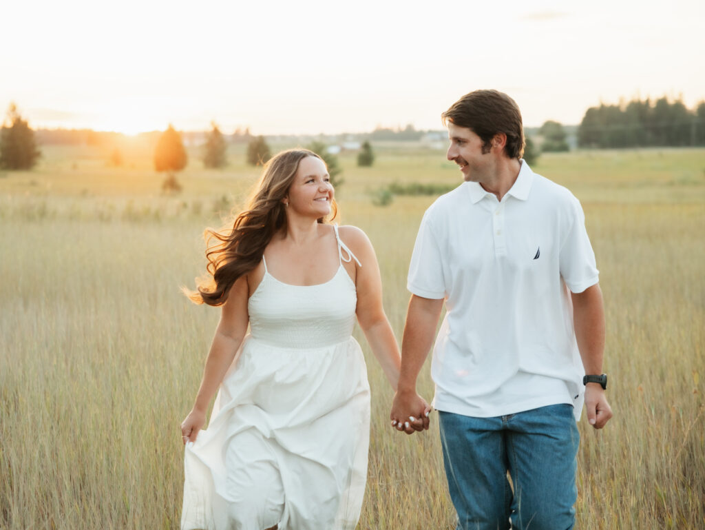 A relaxed late summer engagement session in East Spokane featuring golden fields, natural light, and an outdoors-loving couple.