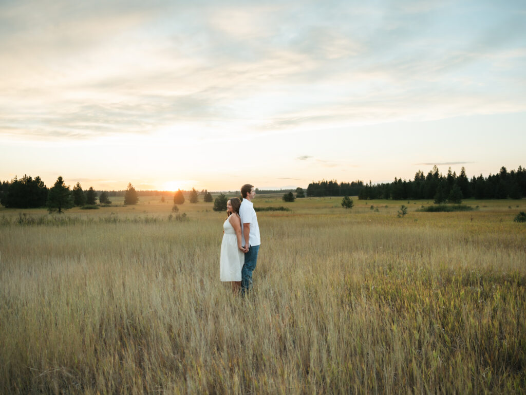 A relaxed late summer engagement session in East Spokane featuring golden fields, natural light, and an outdoors-loving couple.