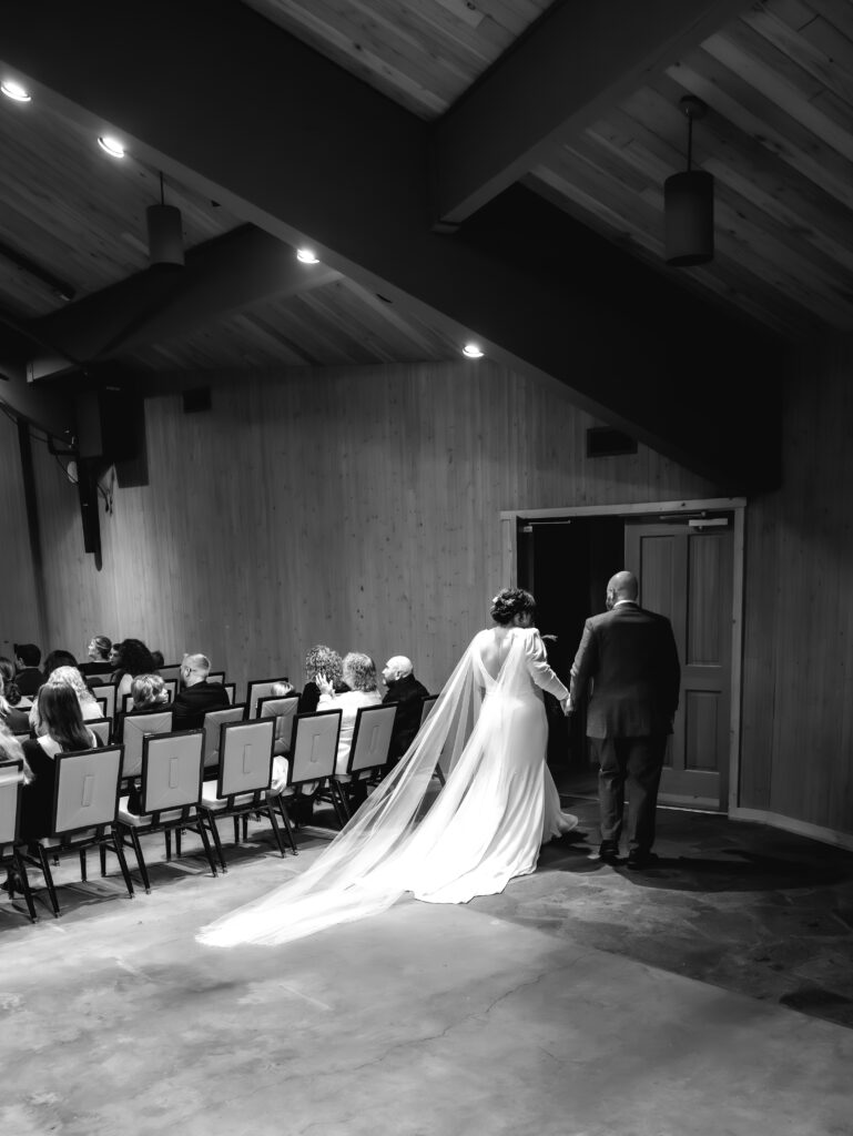 A cozy November wedding at Sleeping Lady Mountain Resort in Leavenworth, WA featuring DIY florals, a bridal cape, and mountain views.