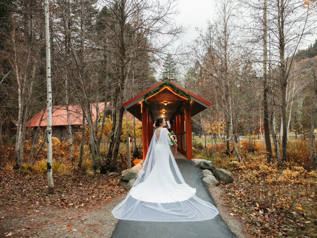 A cozy November wedding at Sleeping Lady Mountain Resort in Leavenworth, WA featuring DIY florals, a bridal cape, and mountain views.