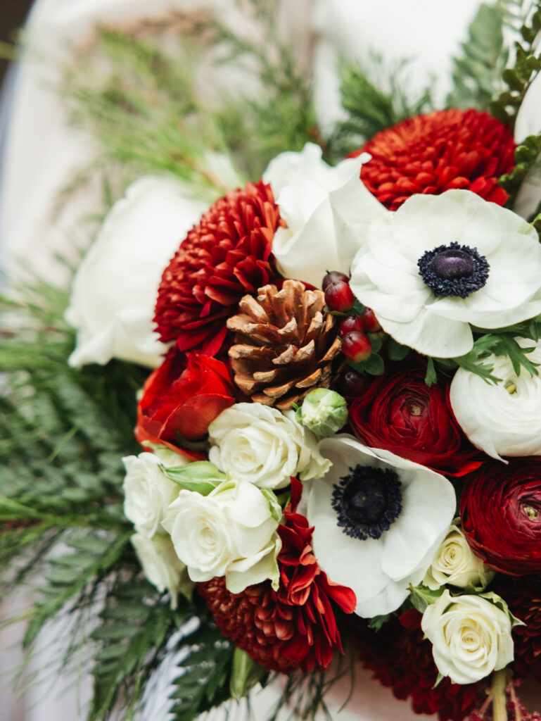 A cozy November wedding at Sleeping Lady Mountain Resort in Leavenworth, WA featuring DIY florals, a bridal cape, and mountain views.