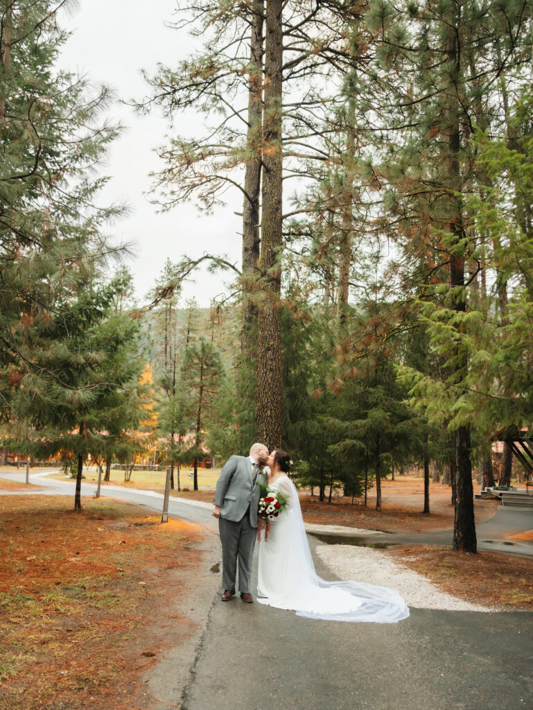 A cozy November wedding at Sleeping Lady Mountain Resort in Leavenworth, WA featuring DIY florals, a bridal cape, and mountain views.
