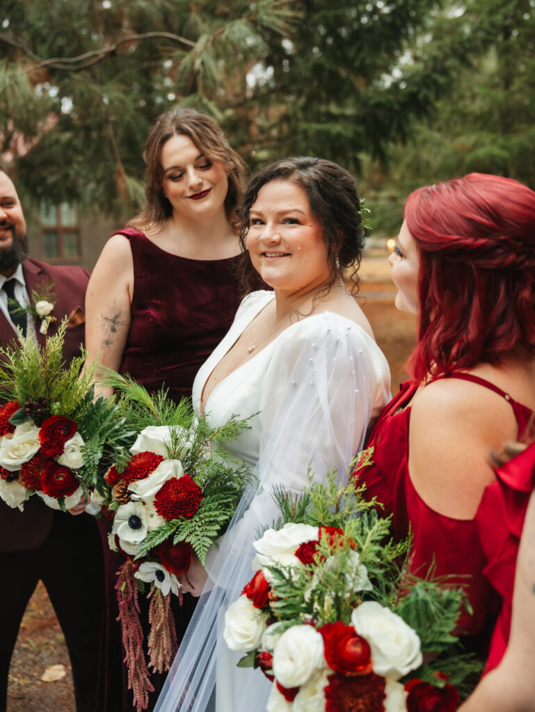 A cozy November wedding at Sleeping Lady Mountain Resort in Leavenworth, WA featuring DIY florals, a bridal cape, and mountain views.