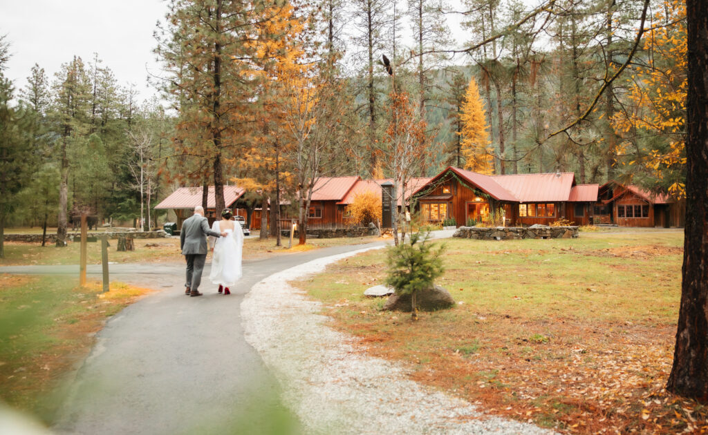 A cozy November wedding at Sleeping Lady Mountain Resort in Leavenworth, WA featuring DIY florals, a bridal cape, and mountain views.