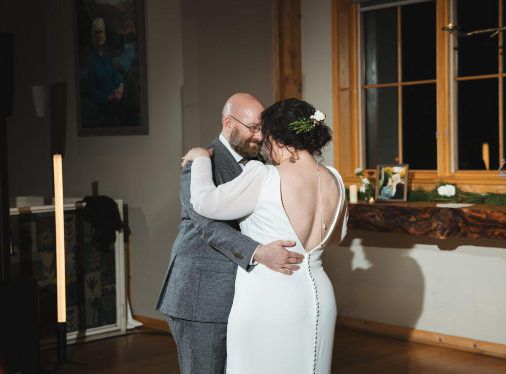 A cozy November wedding at Sleeping Lady Mountain Resort in Leavenworth, WA featuring DIY florals, a bridal cape, and mountain views.