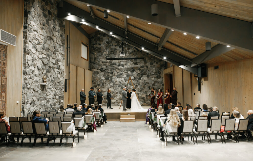 A cozy November wedding at Sleeping Lady Mountain Resort in Leavenworth, WA featuring DIY florals, a bridal cape, and mountain views.