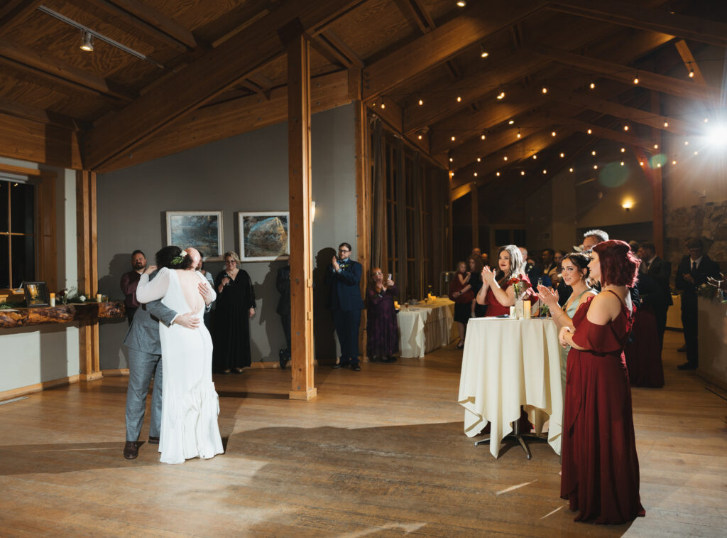 A cozy November wedding at Sleeping Lady Mountain Resort in Leavenworth, WA featuring DIY florals, a bridal cape, and mountain views.
