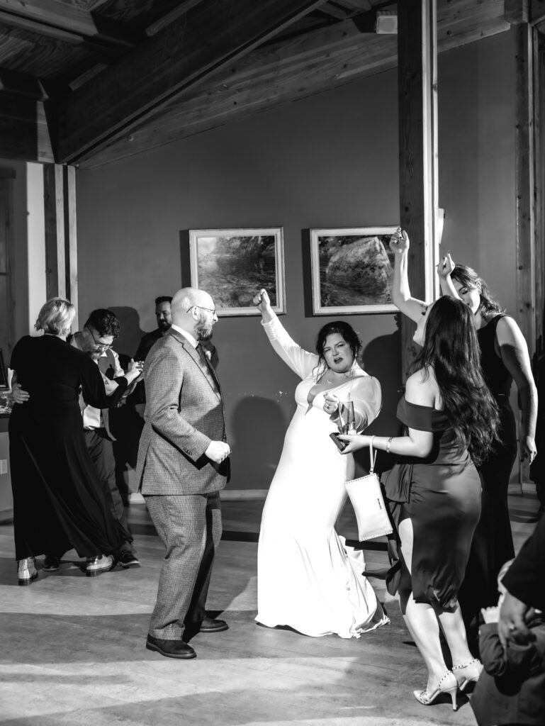 A cozy November wedding at Sleeping Lady Mountain Resort in Leavenworth, WA featuring DIY florals, a bridal cape, and mountain views.