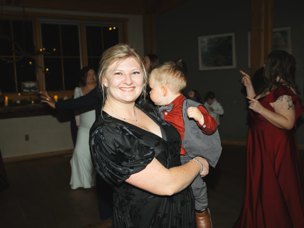 A cozy November wedding at Sleeping Lady Mountain Resort in Leavenworth, WA featuring DIY florals, a bridal cape, and mountain views.