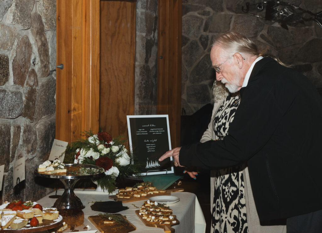 A cozy November wedding at Sleeping Lady Mountain Resort in Leavenworth, WA featuring DIY florals, a bridal cape, and mountain views.