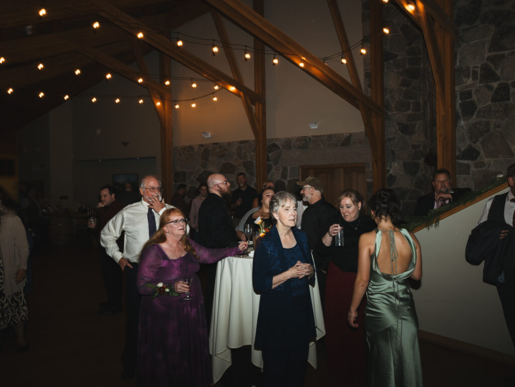 A cozy November wedding at Sleeping Lady Mountain Resort in Leavenworth, WA featuring DIY florals, a bridal cape, and mountain views.