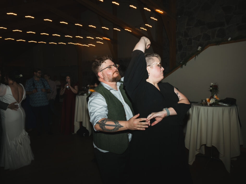 A cozy November wedding at Sleeping Lady Mountain Resort in Leavenworth, WA featuring DIY florals, a bridal cape, and mountain views.