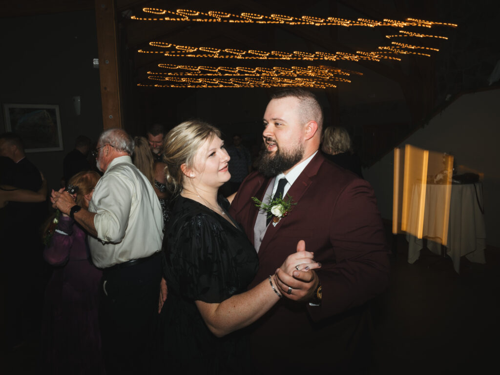 A cozy November wedding at Sleeping Lady Mountain Resort in Leavenworth, WA featuring DIY florals, a bridal cape, and mountain views.