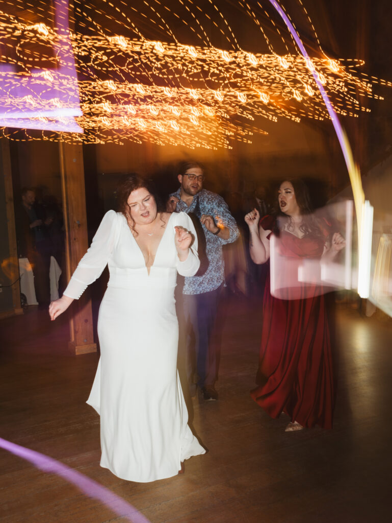A cozy November wedding at Sleeping Lady Mountain Resort in Leavenworth, WA featuring DIY florals, a bridal cape, and mountain views.