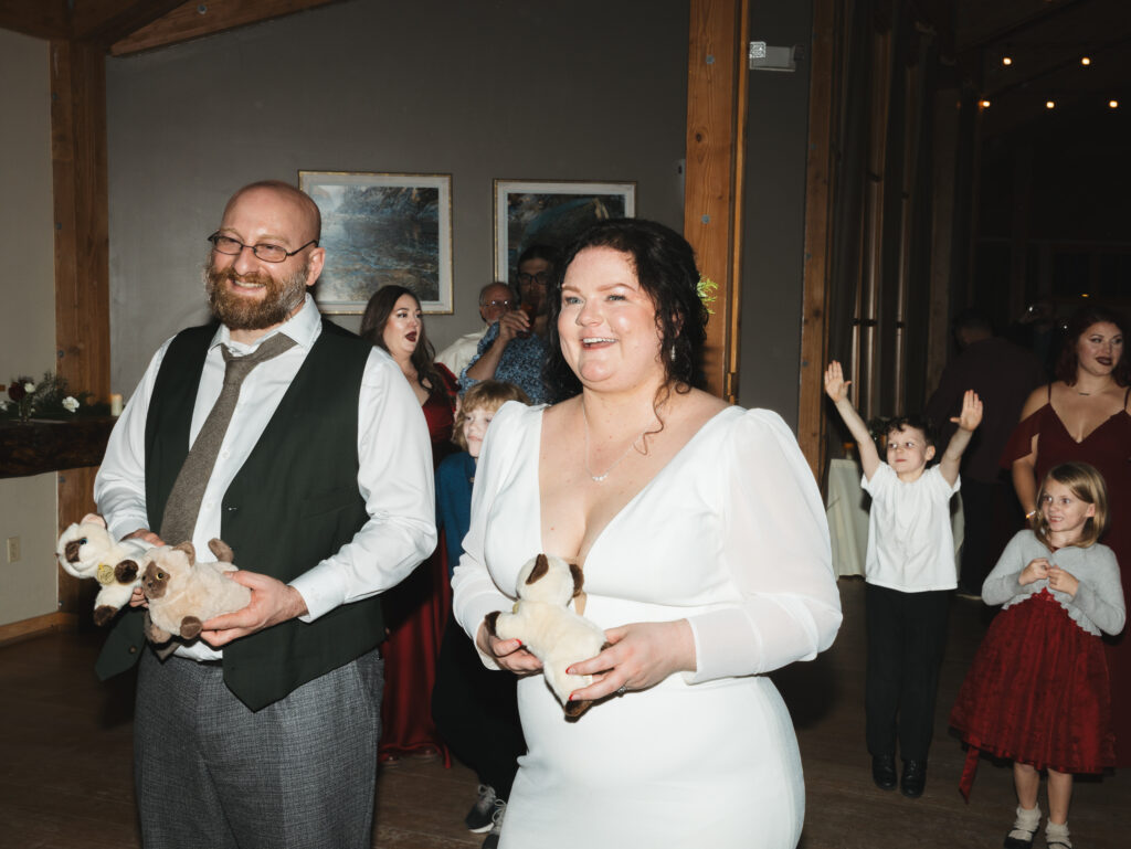 A cozy November wedding at Sleeping Lady Mountain Resort in Leavenworth, WA featuring DIY florals, a bridal cape, and mountain views.