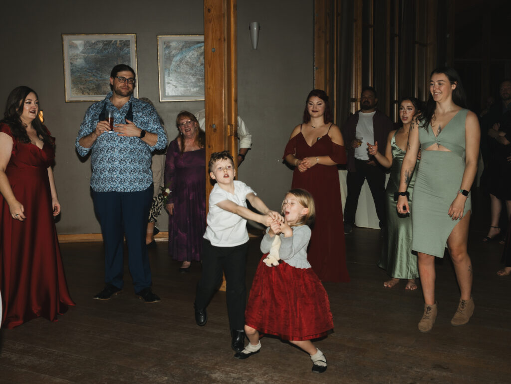 A cozy November wedding at Sleeping Lady Mountain Resort in Leavenworth, WA featuring DIY florals, a bridal cape, and mountain views.