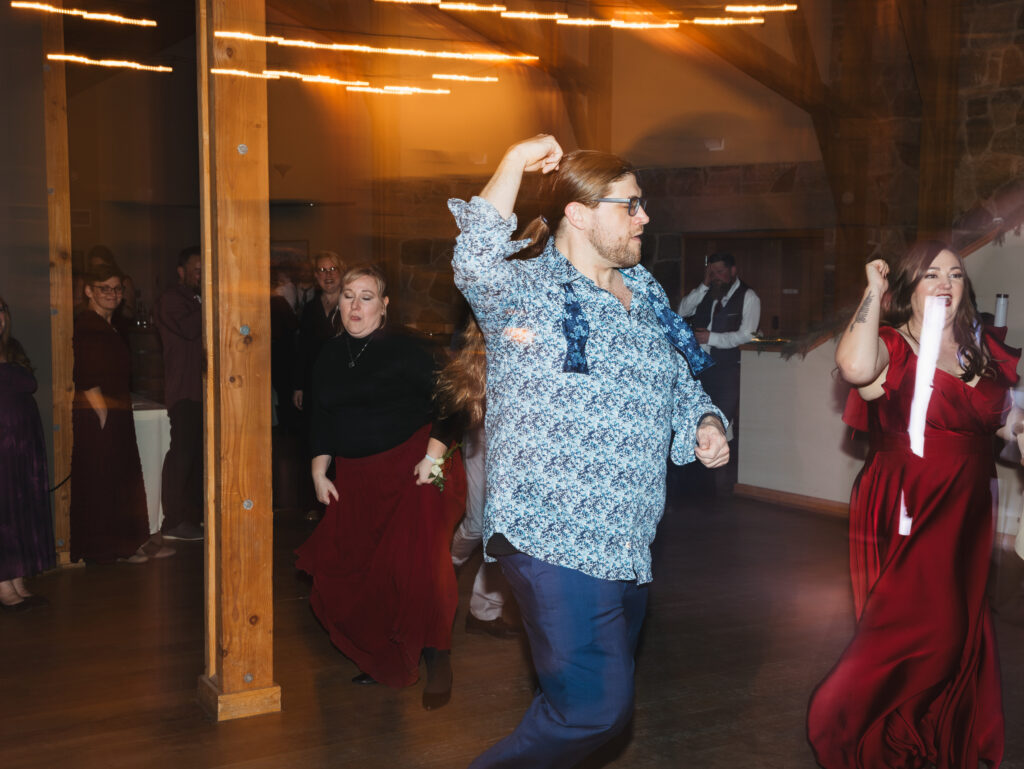 A cozy November wedding at Sleeping Lady Mountain Resort in Leavenworth, WA featuring DIY florals, a bridal cape, and mountain views.