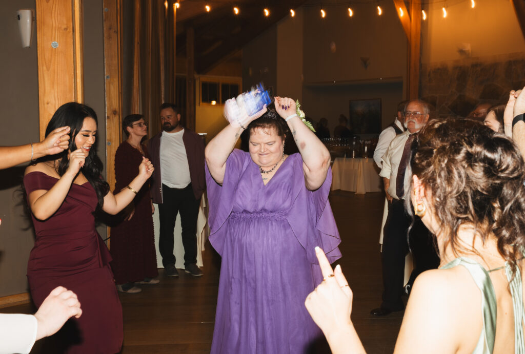 A cozy November wedding at Sleeping Lady Mountain Resort in Leavenworth, WA featuring DIY florals, a bridal cape, and mountain views.
