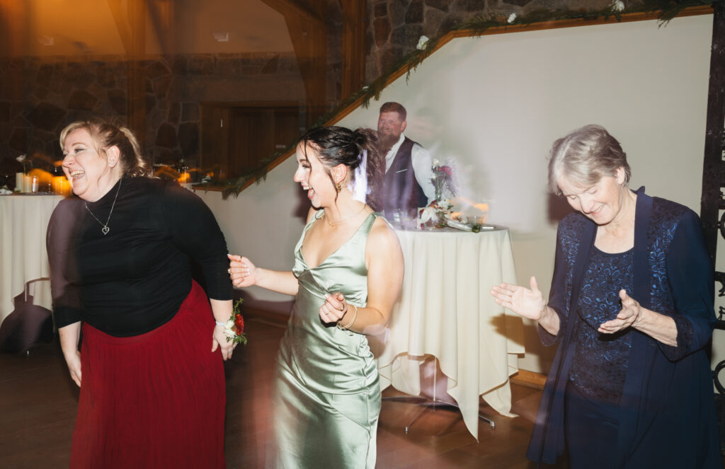 A cozy November wedding at Sleeping Lady Mountain Resort in Leavenworth, WA featuring DIY florals, a bridal cape, and mountain views.