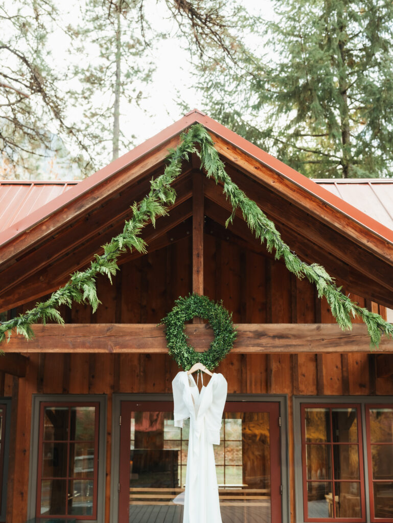 A cozy November wedding at Sleeping Lady Mountain Resort in Leavenworth, WA featuring DIY florals, a bridal cape, and mountain views.