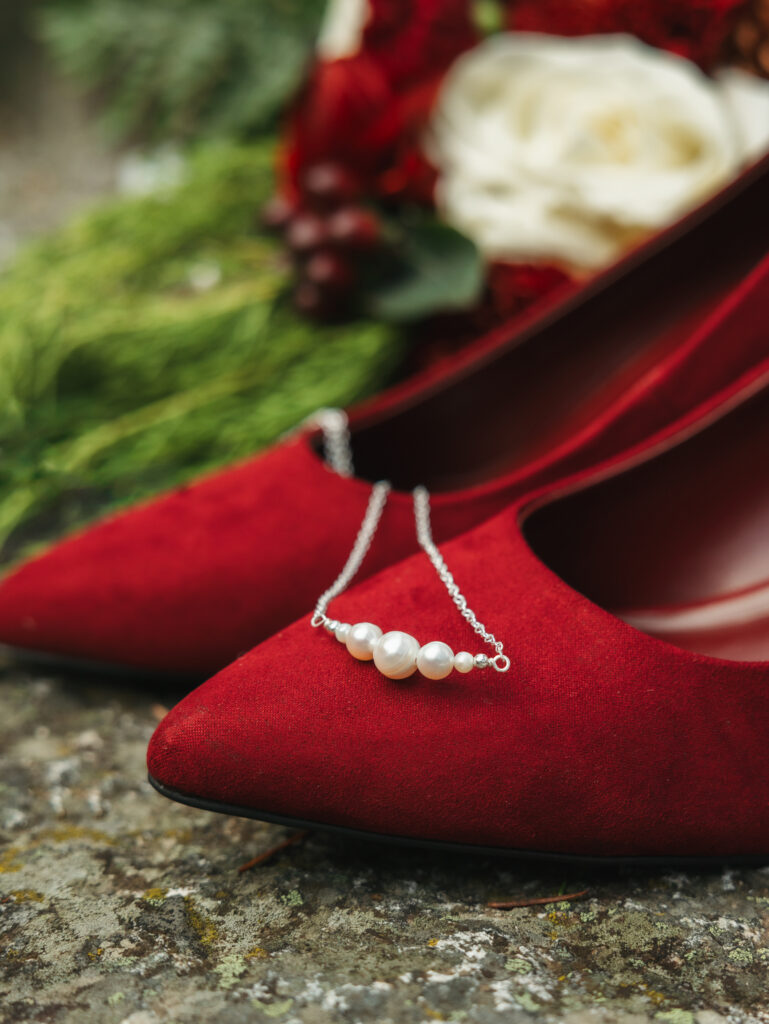 A cozy November wedding at Sleeping Lady Mountain Resort in Leavenworth, WA featuring DIY florals, a bridal cape, and mountain views.