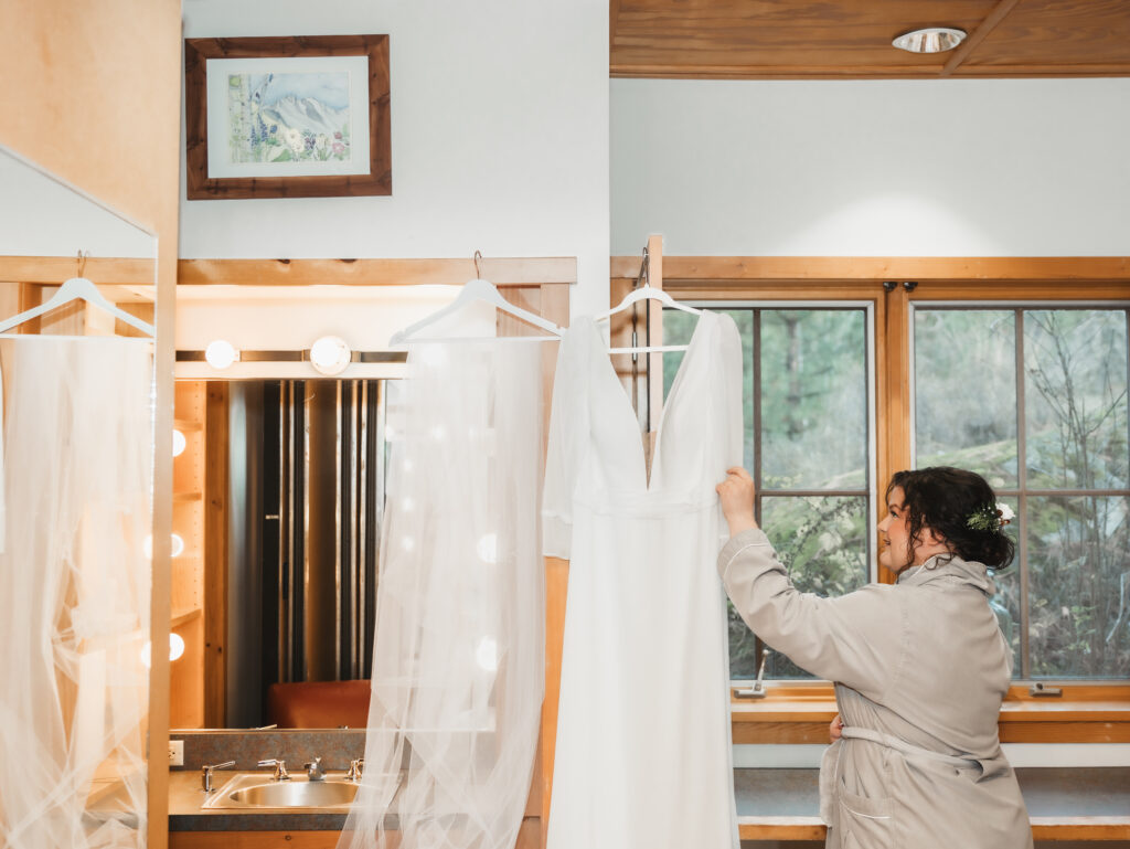 A cozy November wedding at Sleeping Lady Mountain Resort in Leavenworth, WA featuring DIY florals, a bridal cape, and mountain views.