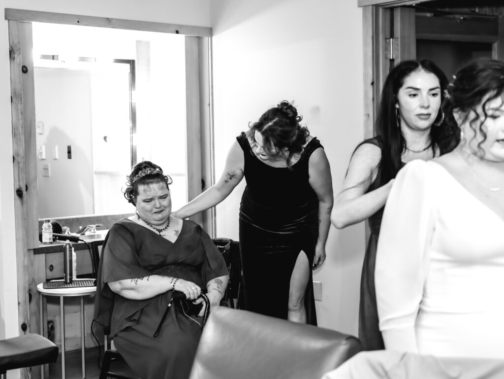 A cozy November wedding at Sleeping Lady Mountain Resort in Leavenworth, WA featuring DIY florals, a bridal cape, and mountain views.