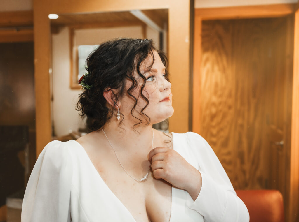 A cozy November wedding at Sleeping Lady Mountain Resort in Leavenworth, WA featuring DIY florals, a bridal cape, and mountain views.