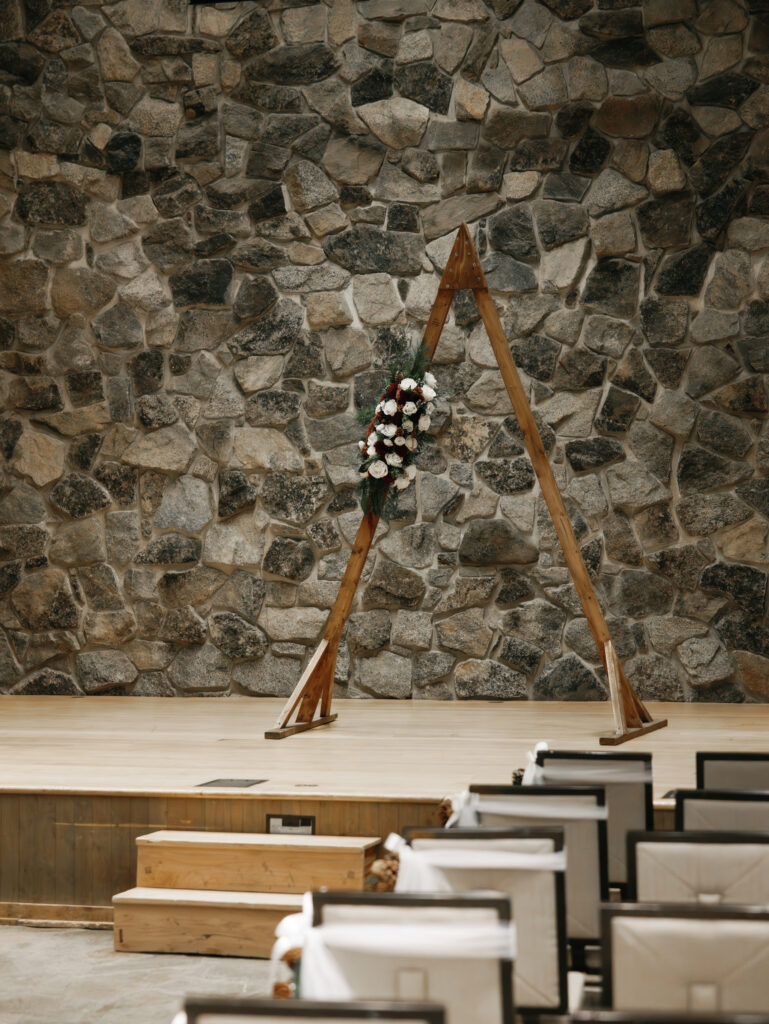 A cozy November wedding at Sleeping Lady Mountain Resort in Leavenworth, WA featuring DIY florals, a bridal cape, and mountain views.